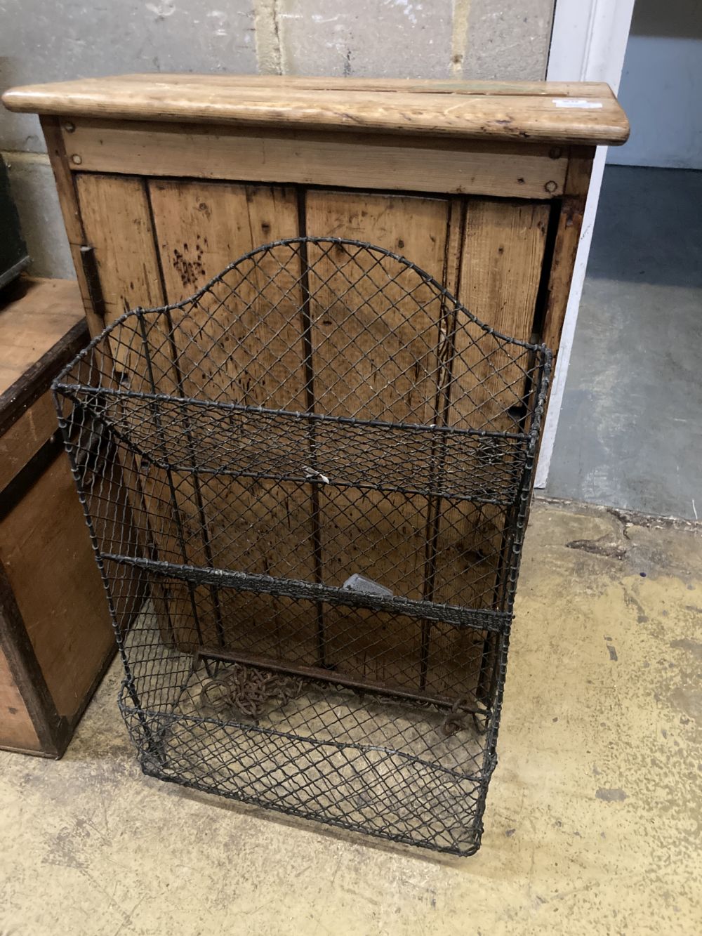 A 19th century pine wall cabinet, width 59cm depth 32cm height 84cm, together with a wirework rack